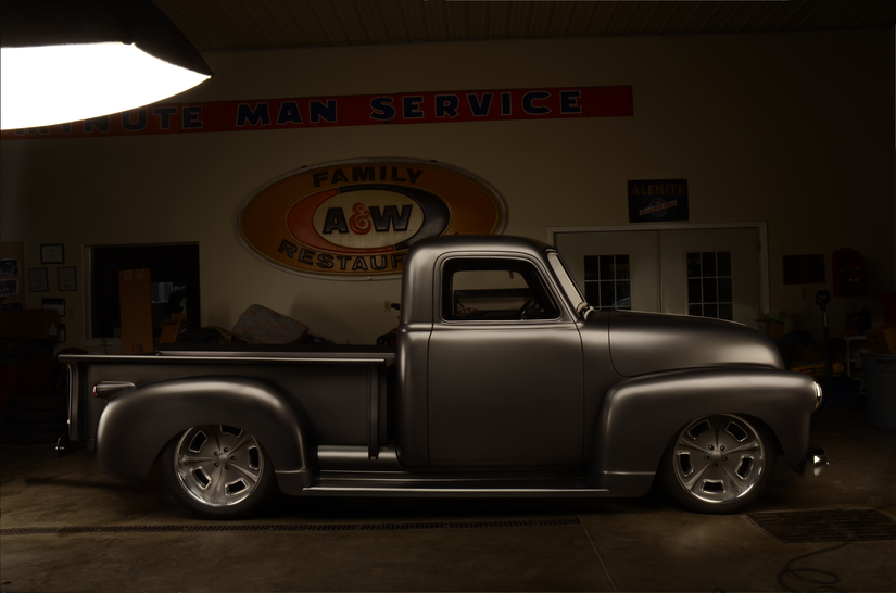 Inside photo shoot of 1949 Chevy Truck with A&W sign at Eddies rod and custom 